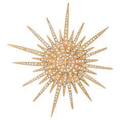 Vintage Chanel Large Starburst crystal brooch (circa 2001) crafted in yellow gold tone. Small crystals are set into the large starburst motif. Large in scale at 3 1/2 inches in diameter, the brooch makes a great statement on a lapel, attached to a scarf, and much more. The brooch is in very good condition showing minimal wear. Particulars: Weight: 31.1 grams Size & Measurements: The brooch measures 3 1/2 inches in diameter. Metal & Hallmark: Yellow gold tone. The brooch is hallmarked "Chanel", "CC", "Made in France" "01" and "P". The brooch dates to 2001 from the continuous Spring. Cl Fashion, Chanel Brooch, Gold Starburst, Gold Sun, Yellow Gold Jewelry, Chanel Jewelry, Crystal Brooch, Gold Brooches, Pin Jewelry