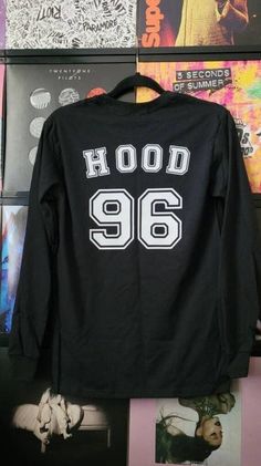 Choose your favorite band member to wear on this cute top! Last name and year in matte white vinyl on the back, and 5SOS name in white glitter on front left corner. Listing is shown in Hood/96 style. Available Styles for Back of Shirt:  -Clifford/95 -Irwin/94 -Hood/96 -Hemmings/96 -5SOS/11 *Long sleeve black tee in adult sizes.  *Garment brands may vary- I use products available to me at your time of purchase.  *Please send me a message with any questions or concerns. *All of my pieces are handm Trendy T-shirt With Heat Transfer Vinyl For Streetwear, Hip Hop Text Print Tops For Fall, 90s Streetwear Tops For Fall, Urban Long Sleeve Tops For Concerts, Hip Hop Winter T-shirt With Screen Print, 90s Style Tops For Fan Merchandise In Fall, 90s Text Print Tops For College, Hip Hop Style Long Sleeve Tops, Hip Hop Tops For Fall Concert