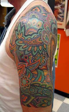 a man with a colorful tattoo on his arm