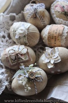 some ornaments are sitting in a bowl on a doily