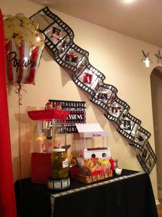 a table topped with lots of food and balloons