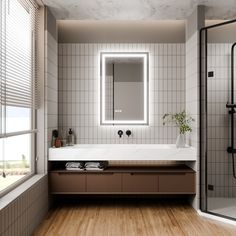 a bathroom with a sink, mirror and bathtub in the middle of the room