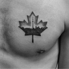 a black and white photo of a canadian maple leaf with the skyline on it's chest