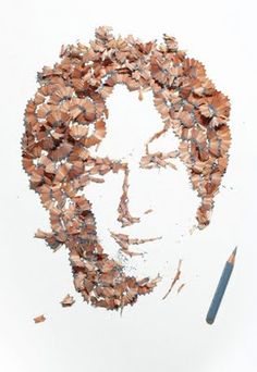 a drawing of a man's face made out of pencil shavings and crayons