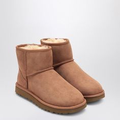 Chestnut suede ankle boot from UGG featuring sheepskin and suede upper, round toe, sheepskin insole and Treadlite sole by UGG. Boot height: 13.97 cm.Gender: WomenMaterial: 100% Sheep skin or lambskin / Rubber soleColor: BROWNMade in: VNProduct ID: 1016222SUE/P_UGG-CHE*Import tax/duty will be calculated at checkout (If applicable) Mini Ugh Boots, Ugg Classic Ultra Mini Chestnut, Mini Uggs Chestnut, Dark Brown Ultra Mini Uggs, Ugg Classic Mini Brown, Ugg Shoes Women, Ugg Classic Mini Ii, Chestnut Boots, Ugg Boot