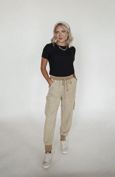 Lightweight black joggers with cargo pockets and a drawstring waist. Large band at the waistline and ankles. Super soft material for all day comfort, and a look you can dress up or down! Model is wearing a size S. We think these tend to run a little bit big, so size down if between sizes. 100% Tencel Short Jean Skirt, Cc Beanie, Joggers Outfit, Wild Rag, Cargo Joggers, Black Joggers, Shoe Gifts, Jean Skirt, Accessories Bracelets