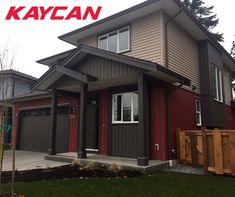 a red and gray house with the name kaycan on it