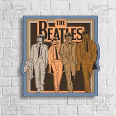 the beatles poster on a brick wall