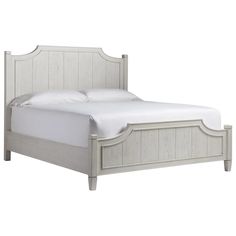 a bed with white linens and wooden headboard on top of it, against a white background