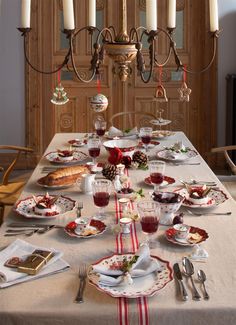 a dining room table is set for christmas dinner