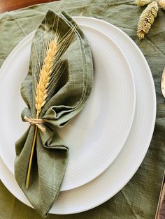 a plate with a napkin and some wheat on it