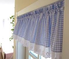 blue and white checkered curtains hanging on the side of a window with lace trim