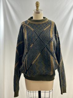 I know either you or your significant other had one of these sweaters in the 80s or 90s. A classic olive, blue and yellow acrylic knit sweater in a geo print pattern with leather detailing.    -Vintage 80s -Acrylic knit,  leather patchwork  -Machine wash gentle  Measurements: *Sleeve 22.5 inches *Bust 24  inches *Length 25 1/2 inches *Bottom 16 1/2 inches  *Please note this item is pre loved and there may be minor flaws to the garment. Not to worry if there is anything major we will let you know Grandpa Sweater, Leather Patchwork, Geo Print, Vintage Knitting, Leather Patches, Tan Leather, Pullover Sweaters, Sweater Outfits, Etsy Vintage