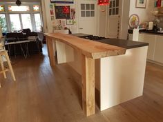 a kitchen with an island made out of wood