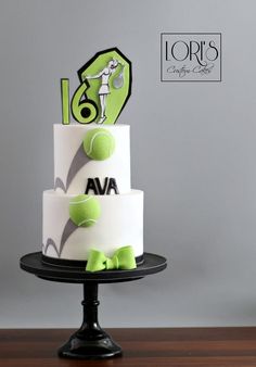 a white and green cake with tennis balls on it's tiered display stand