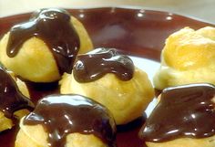 chocolate covered pastries are on a plate