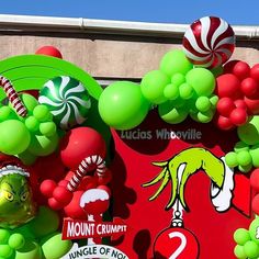 there are many balloons and candy on the street sign for this carnival parade in las cruces whoville