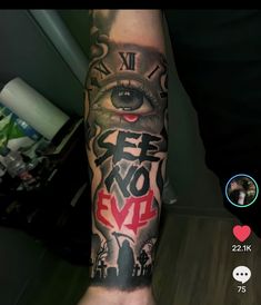 a man's arm with an eye and words on it, including the word love