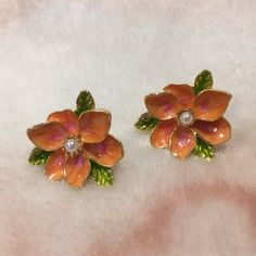 Fall Autumn Enamel Fashion Pierced Earrings Set In Gold Toned Metal Alloy With Surgical Steel Posts. Faux Pearl Centers. Pretty Moss Green Leaves With Soft Orange Flower Petals Make These A Lovely Enamel Autumn Fashion Accessory Nwt Measure 1” Across .75” Deep. Lightweight Earrings. Elegant Orange Flower Earrings, Orange Flower Earrings For Gift, Orange Earrings For Spring Gift, Spring Gift Orange Earrings, Orange Flower Earrings For Spring, Horror Earrings, Fall Fashion Accessories, Pearl Statement Earrings, Soft Orange