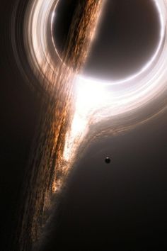 a black object is seen in the sky with light coming from it's center