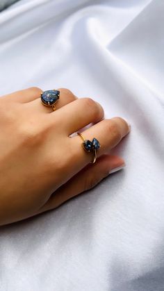 Step into a world of regal elegance with our Lapis Lazuli adjustable ring. Plated in 18ct gold over 925 silver, it radiates opulence and grace. Feel the celestial energy as the cobalt hues of Lapis Lazuli dance upon your finger, evoking power and wisdom. Handcrafted to perfection, each ring tells a unique story, crafted with real, undyed gemstones. Embrace your inner queen, for this stone holds the secrets of femininity and divine connection. Let your style ascend to new heights with our enchant Adjustable Open Sapphire Ring, Adjustable Gold Sapphire Ring For Promise, Adjustable Sapphire Open Ring Gift, Adjustable Open Sapphire Ring As Gift, Adjustable Open Sapphire Ring Gift, Gold Teardrop Sapphire Gemstone Ring, Adjustable Yellow Gold Teardrop Rings, Adjustable Teardrop Crystal Ring With Gemstone, Adjustable Teardrop Yellow Gold Ring