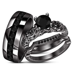 two wedding rings with black diamonds on each one and an engagement ring in the other