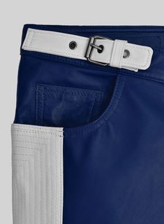 Indulge in a sleek and cool aesthetic with our unparalleled leather pants. Made from luxurious PURE Napa leather, these electric zipper pants feature a striking two-tone blue and white pattern for a truly standout look.     Trust us, these leather pants are a must-have for any fashion-forward individual.    Made Using Pure Napa Sheep Skin Soft Leather    Look Includes    Rich     Blue  Leather   White Color of Stripe   Antique Silver  Zipper   Click 'Customize Now' to modify the look if needed. Modern Blue Pants With Belt Loops, Fitted Blue Leather Bottoms, Blue Leather Pants, Black Tuxedo Shirt, Grey Tweed Suit, Windowpane Suit, Herringbone Tweed Jacket, Seersucker Suit, Tweed Pants