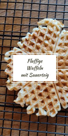 waffles on a cooling rack with the words fluffere walfein mit sauereig