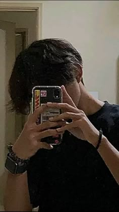 a person taking a selfie in front of a mirror