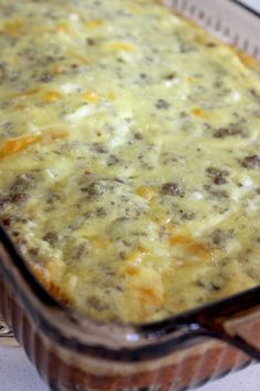 a casserole dish with meat and cheese in it