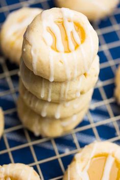 several cookies with icing on a cooling rack