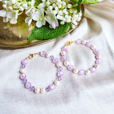 Purple Pearl Bracelet - Baroque Pearl Bracelet - Purple Bracelet - Violet - Lilac - Pastel Pearl Bracelet Item Details: ⭐ This bracelet is so simple yet on point, in trend and chic. It's made with pastel purple jade beads and baroque pearls. Another option is made with beautiful shiny purple glass beads. ⭐ This bracelet is 18cm long. You can request your own desired length if this is not the length you like.  ⭐ The bracelet is made with 18k gold-plated gold chain 💻😊 P.S. If this length is not Lavender Bracelets With Colorful Beads, Pearl Bracelets With Faceted Round Beads, Lavender Bracelets With Spacer Beads For Gift, Lavender Bracelets With Spacer Beads As Gift, Lavender Beaded Bracelets With Round Beads As Gift, Pearl Beaded Bracelets With Faceted Beads, Purple Beaded Pearl Bracelets, Lavender Beaded Bracelet Jewelry, Pearl Bracelets With Spacer Beads For Gifts