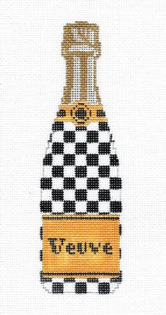 a cross stitch picture of a bottle of perfume