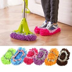 a person standing on the floor with a mop in front of them and four different colors