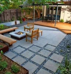 an outdoor patio with seating and fire pit