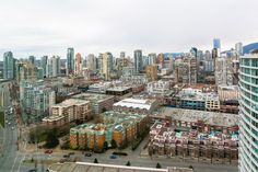 an aerial view of a city with tall buildings