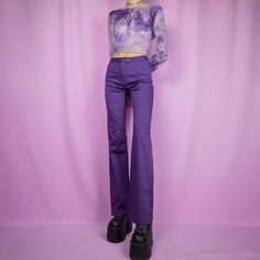 The Vintage 90s Purple Straight Leg Trousers are classic retro dark purple high waisted pants slightly stretchy. Made in Italy. ESTIMATED SIZE XS TAG SIZE Italy 42 MEASUREMENTS Waist 68cm - 26.77 inch Hips 90cm - 35.43 inch Inseam 85cm - 33.46 inch Our model is 172 cm tall and usually wears size XS.  We ship worldwide from Spain and offer free shipping on all orders when you buy 3 items or more! ♥ https://adultworldshop.etsy.com ♥ WWW.ADULTWORLDSHOP.NET ♥ INSTAGRAM & TIKTOK @adultworldshop Womens Purple Pants, Purple Straight Leg Pants For Fall, Purple Stretch Bottoms For Fall, Trendy Purple Pants For Fall, Y2k Style Bottoms For Night Out In Fall, Purple Straight Leg Bottoms For Fall, Purple Trousers For Night Out, Trendy High Waist Purple Pants, Fall Purple Straight Leg Bottoms