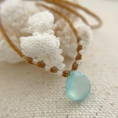 The perfect Beach Boho gift for women. A beautiful aqua chalcedony briolette and sparkly faceted rainbow moonstone beads are handwoven onto waxed polyester. Perfect for girls with an active lifestyle! This necklace is waterproof and sweatproof so you can wear it from the surf or the trail to the shower.💙 MADE TO ORDER! Please choose your desired length in inches. Or leave me a message at checkout with a custom size. This briolette is dainty and I don't recommend a length longer than 18 inches.? Festival Jewelry With Sliding Knot On Nylon Cord, Turquoise Faceted Beaded Necklaces For Beach, Everyday Bohemian Nylon Cord Jewelry, Bohemian Beach Necklace With Faceted Beads, Artisan Beach Necklace With Dangling Beads, Handmade Spiritual Jewelry With Nylon Cord, Adjustable Knot Nylon Cord Jewelry For Festival, Adjustable Nylon Cord Necklace For Gift, Bohemian Chalcedony Natural Stone Necklace