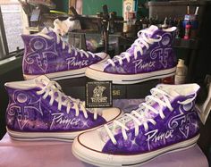 purple high top sneakers painted with prince v and the word prince v in white lettering