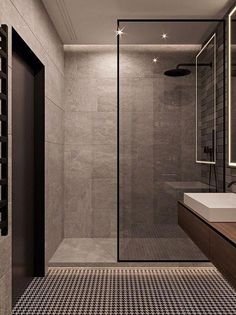 a bathroom with a sink, mirror and shower stall in the middle of the room