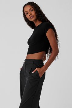 Cut from a soft, stretchy, ribbed fabric blend, this trusty tee is a closet staple you’ll want to buy in multiples. It has a classic crewneck, a slim fit, and not-too-short, not-too-long cap sleeves. Finished with a waist-length crop to pair perfectly with all your favorite high-waisted bottoms. Casual Ribbed Alo Yoga Tops, Alo Yoga Fitted Everyday Tops, Alo Yoga Fitted Tops For Everyday, Black Ribbed Fitted T-shirt, Sea Coast, Tank Top Bras, Womens Capris, Tank Top Long Sleeve, Alo Yoga