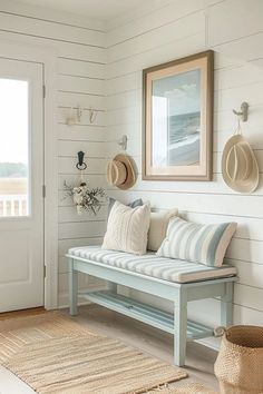 a white bench sitting in front of a door