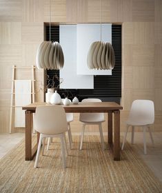 a modern dining room with white chairs and wooden table