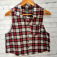 Super Cute! Wild Fable Sleeveless Flannel Top In Size Medium. Red And Black Flannel. Front Pocket And Button Front. Nwot. Thanks For Looking Sleeveless Tops With Button Closure For Fall, Red Sleeveless Vest With Buttons, Casual Plaid Sleeveless Vest, Casual Plaid Vest Top, Red Sleeveless Top With Button Closure, Plaid Cotton Sleeveless Tank Top, Casual Plaid Sleeveless Tank Top, Sleeveless Flannel, Red And Black Flannel