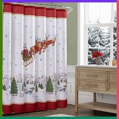 a christmas shower curtain with santa sleigh and reindeer on it in front of a window