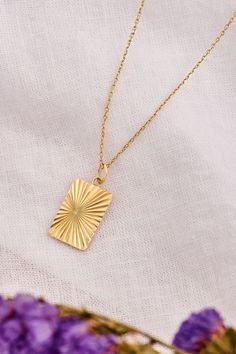 Radiate elegance with our solid gold rectangle sun necklace. This stunning piece captures the essence of timeless beauty and modern sophistication, perfect for adding a touch of brilliance to any outfit. ☀️💛 #SunshineInStyle Gift Necklace With Rectangular Links And Polished Finish, Polished Rectangular Link Necklace For Gift, Gift Diamond Cut Necklace With Rectangular Pendant, Rectangular Yellow Gold Necklace With Polished Finish, Gold Rectangular Diamond Cut Necklace, Yellow Gold Rectangular Diamond Cut Necklace, Rectangular Yellow Gold Necklace With Diamond Cut, Rectangular Diamond Cut Gold Necklace, Gold Rectangular Diamond-cut Necklace