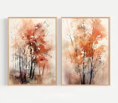 two paintings with trees painted in watercolor on them, one is orange and the other is brown