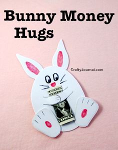 a white bunny magnet with the words funny money hugs on it's face and pink background