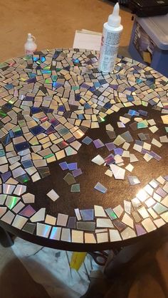 a table that has some kind of mosaic design on it