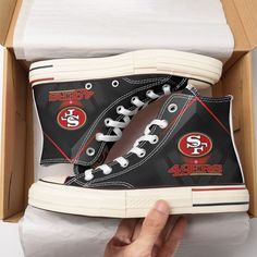 San Francisco 49Ers New High Top Canvas Shoes 46 - Alwaysky Sneakers Design For Fan 2024. Unleash your wild side with these dynamic sneakers featuring an eye-catching dinosaur-themed print against a dark backdrop with vibrant floral accents. The high-quality construction and classic silhouette offer durability and timeless style. Ideal for the adventurous spirit, these shoes effortlessly transition from day to night. Celebrate individuality and strength with this unique addition to any shoe coll 49ers Shoes, Back To School Shoes, Soft Textiles, School Shoes, High Top Shoes, San Francisco 49ers, Black Laces, Dinosaur Print, Canvas Shoes